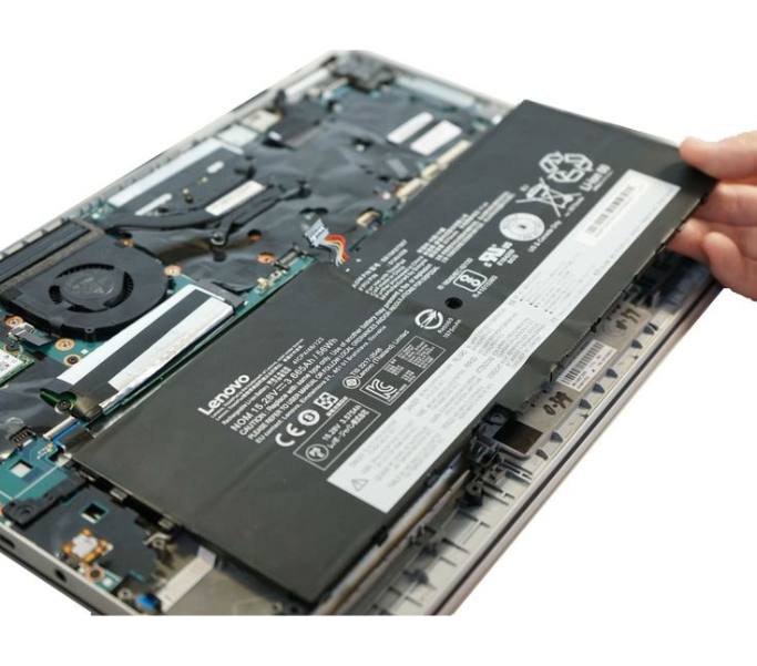 Open laptop showing internal battery and hardware components